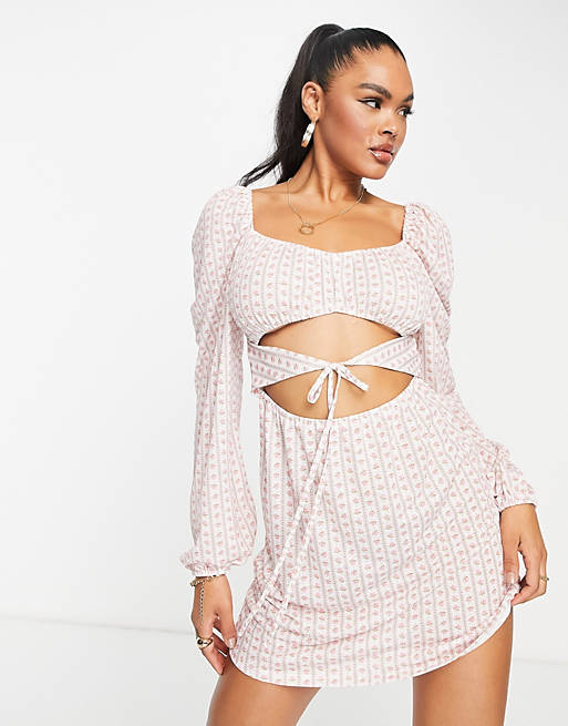 Dresses long sleeve cut out dress in pink floral stripe 