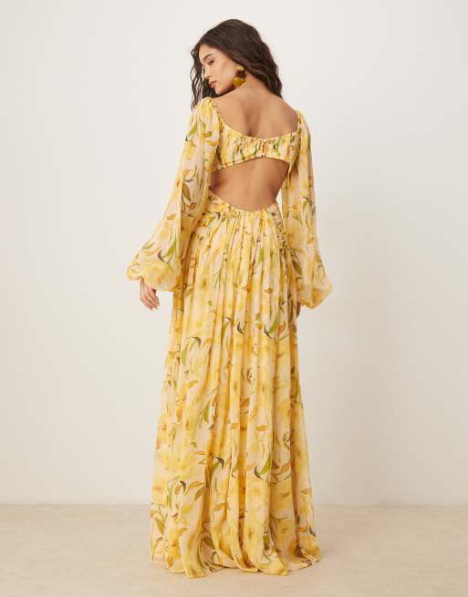 ASOS DESIGN long sleeve cut-out maxi dress with ruched skirt in yellow floral print