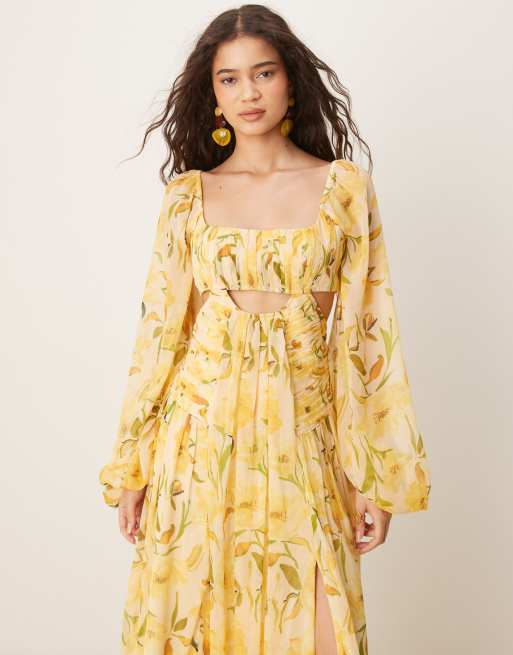 ASOS DESIGN long sleeve cut-out maxi dress with ruched skirt in yellow floral print