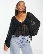 ASOS DESIGN dobby blouse with volume sleeve & tie front in black