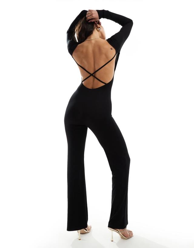 ASOS DESIGN - long sleeve flared leg jumpsuit with open back and strap detail in black