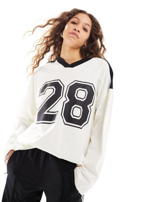 ASOS DESIGN long sleeve football tee with number 28 graphic and V-neck in ivory