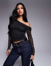 ASOS DESIGN Petite high rise barrel leg jeans in mid blue