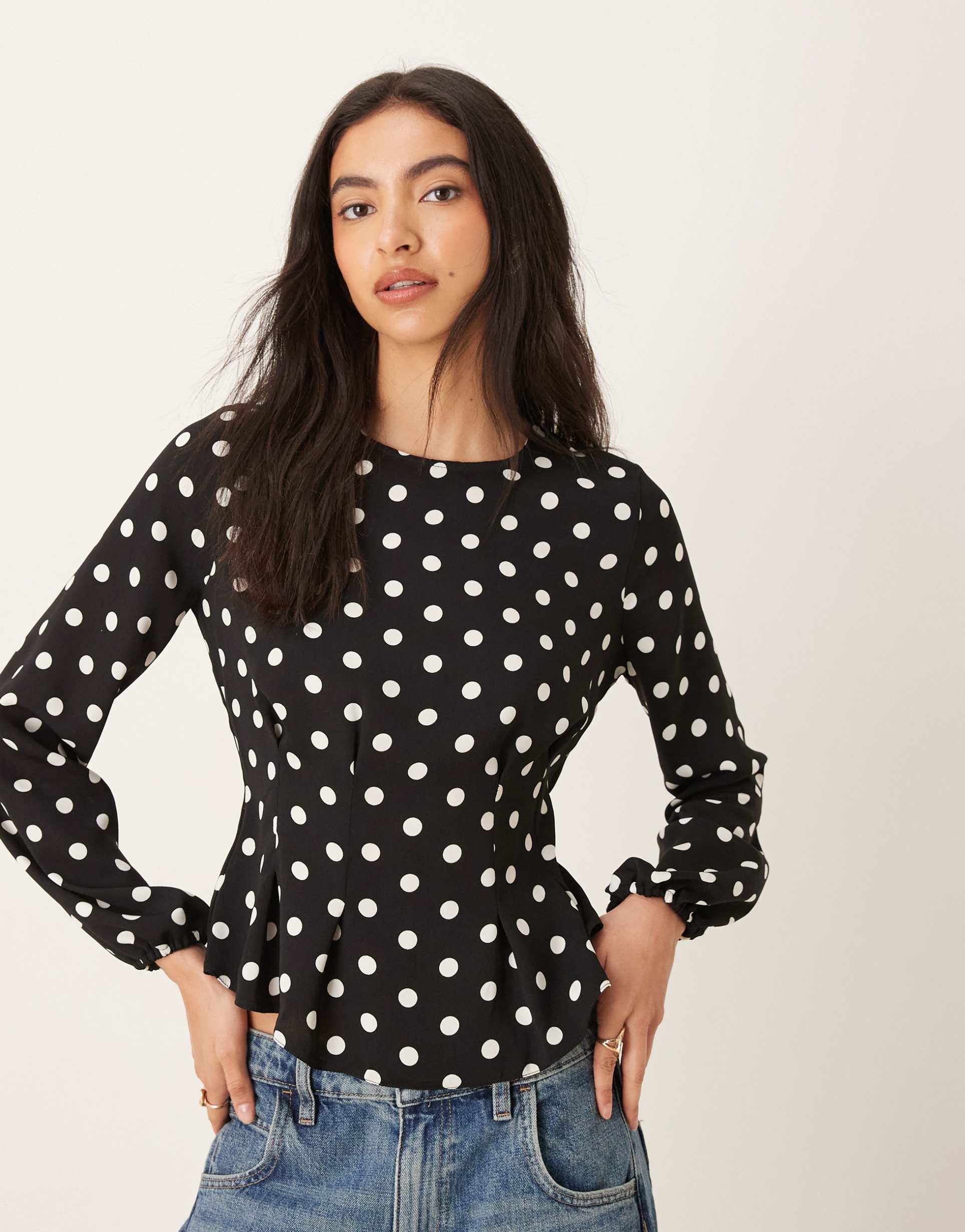 asos design long sleeve peplum top in polka dot