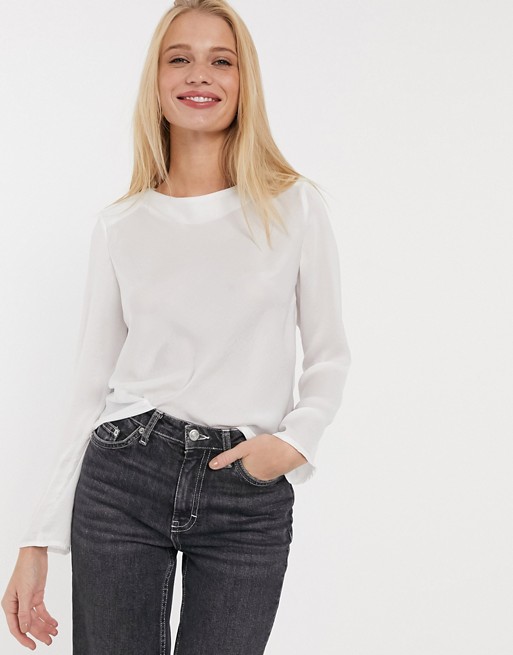 ASOS DESIGN long sleeve satin top with shoulder pads in ivory