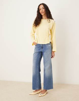 Asos Design Long Sleeve Seam Detailing Corset Tee In Yellow