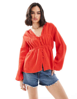 long sleeve smock top with button front in red