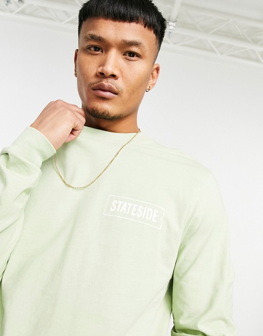 ASOS DESIGN long sleeve t-shirt in green with text chest print