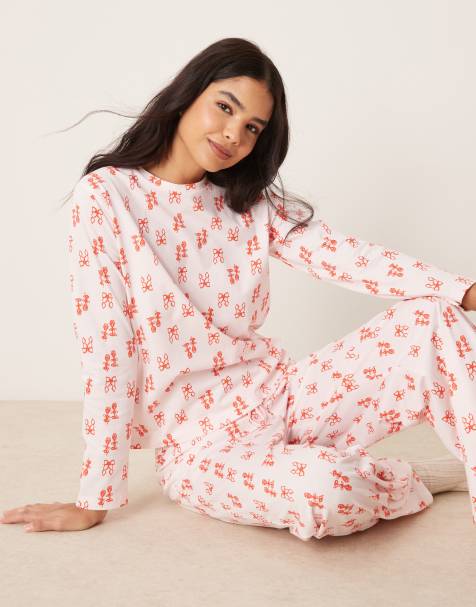 ASOS DESIGN long sleeve top & trouser pyjama set in pink and red bow print - view 1