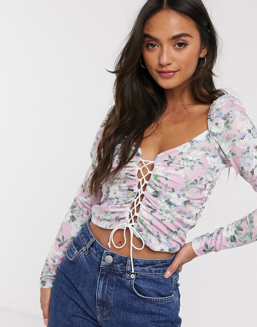 ASOS DESIGN long sleeve top with lace up front in floral print-Pink