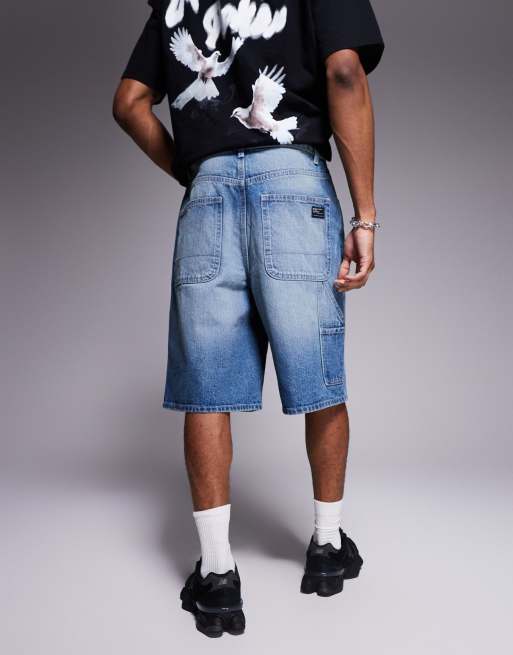 ASOS DESIGN longer length carpenter denim jorts in mid wash blue