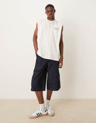 ASOS DESIGN longer length denim jort in mid wash blue - view 1