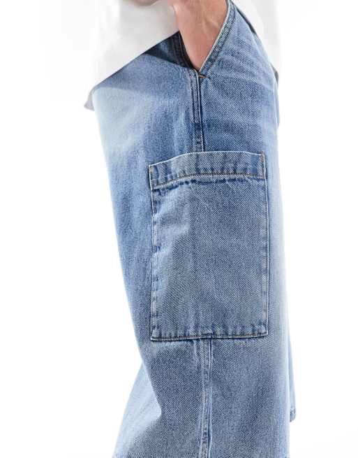 ASOS DESIGN longer length denim jorts in mid wash blue with cargo pocket details