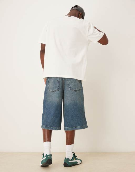 ASOS DESIGN longer length denim jorts in mid wash blue