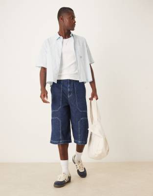 longer length denim jorts in raw wash-Blue