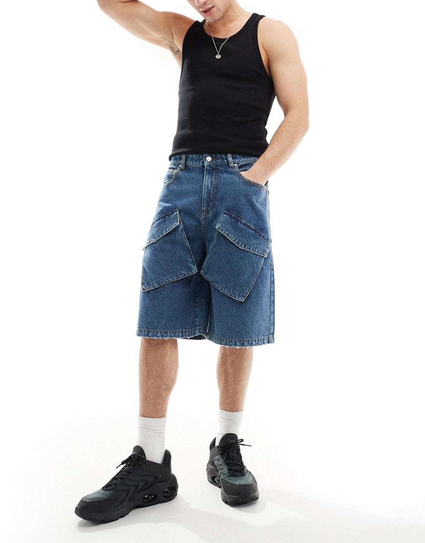 ASOS DESIGN longer length denim shorts with cargo detail in vintage mid blue