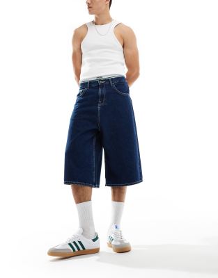 longer length jorts in dark wash blue