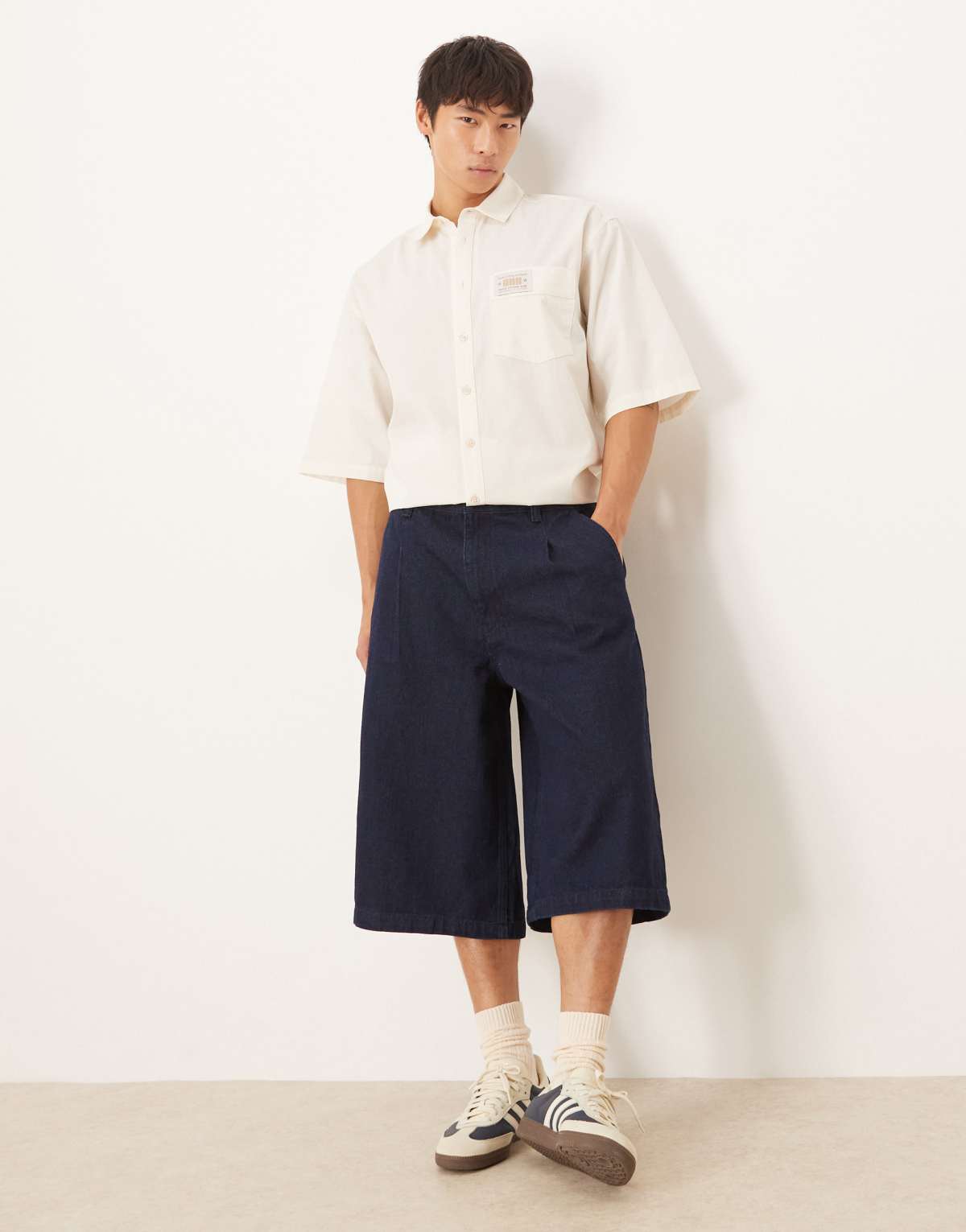 ASOS DESIGN longer length pleated denim jort in raw wash