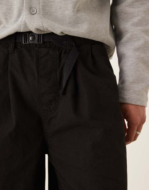 ASOS DESIGN longer length pleated shorts with belt in black