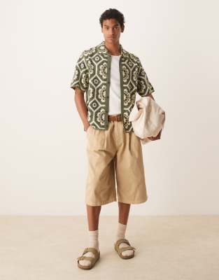 ASOS DESIGN longer length shorts in beige with double pleats