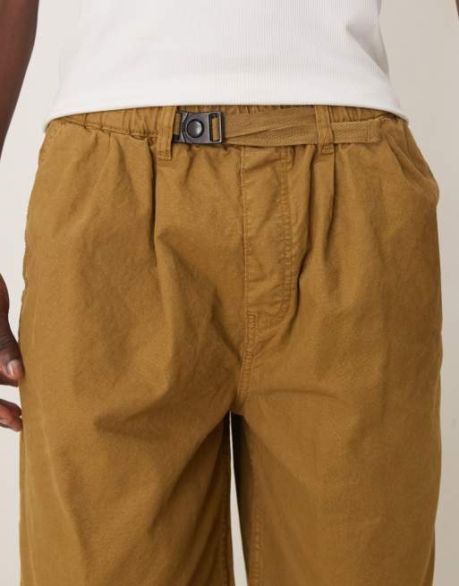 ASOS DESIGN longer length shorts with belt and pleats in olive green, 5 of 5