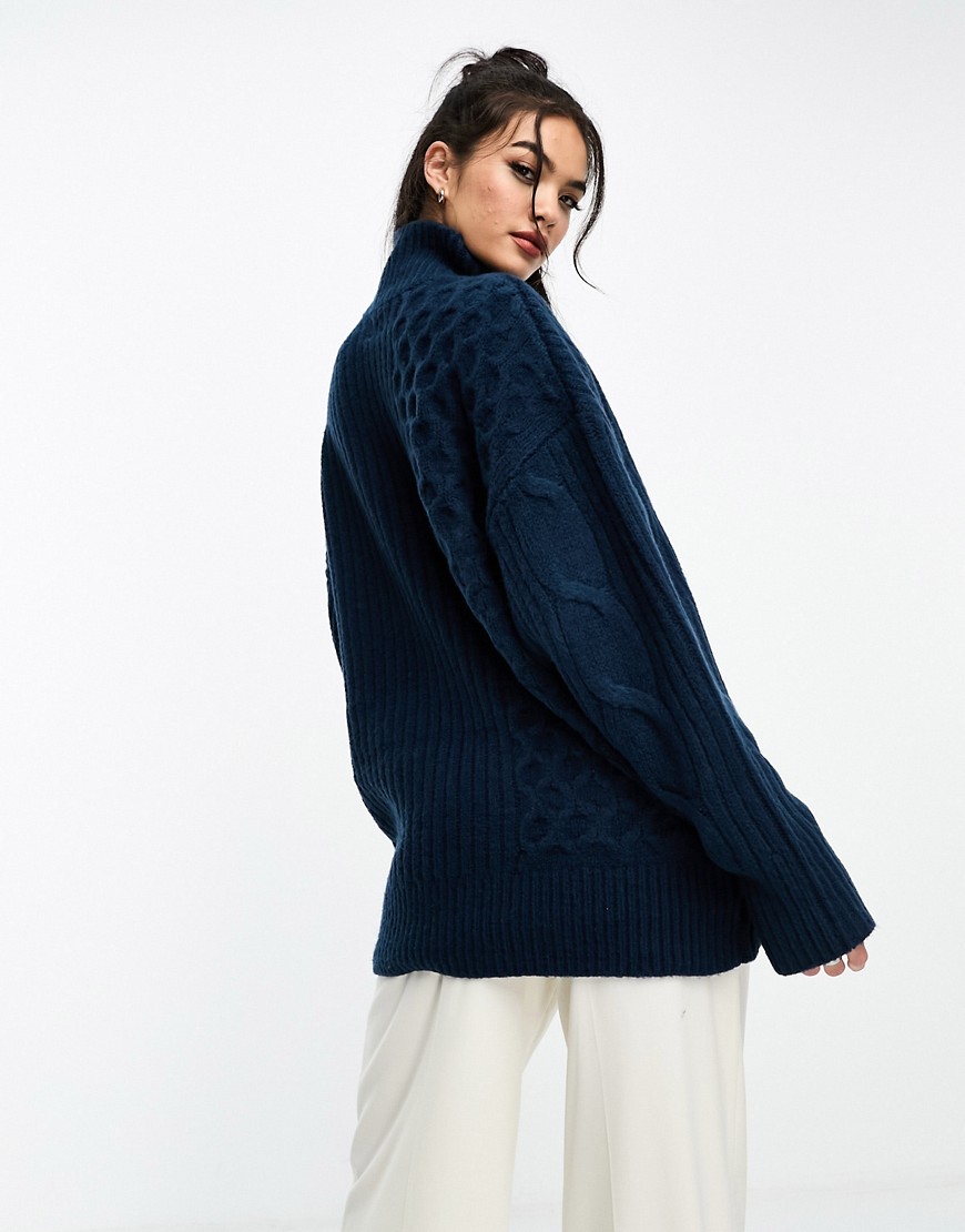 ASOS DESIGN longline cable jumper with high neck in navy
