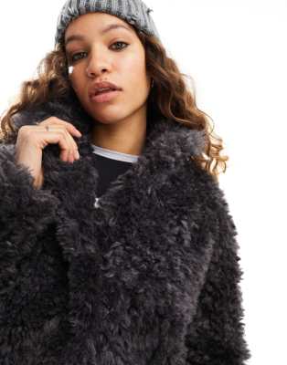 ASOS DESIGN curly faux sheepskin jacket in sand