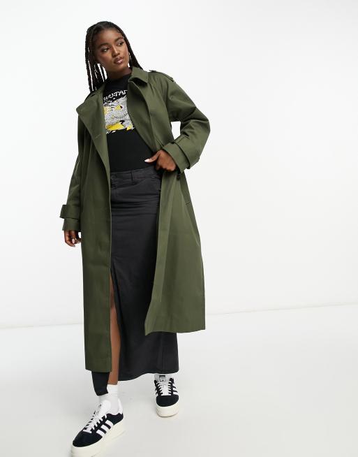 Combining white Dr. Martens with a trench coat