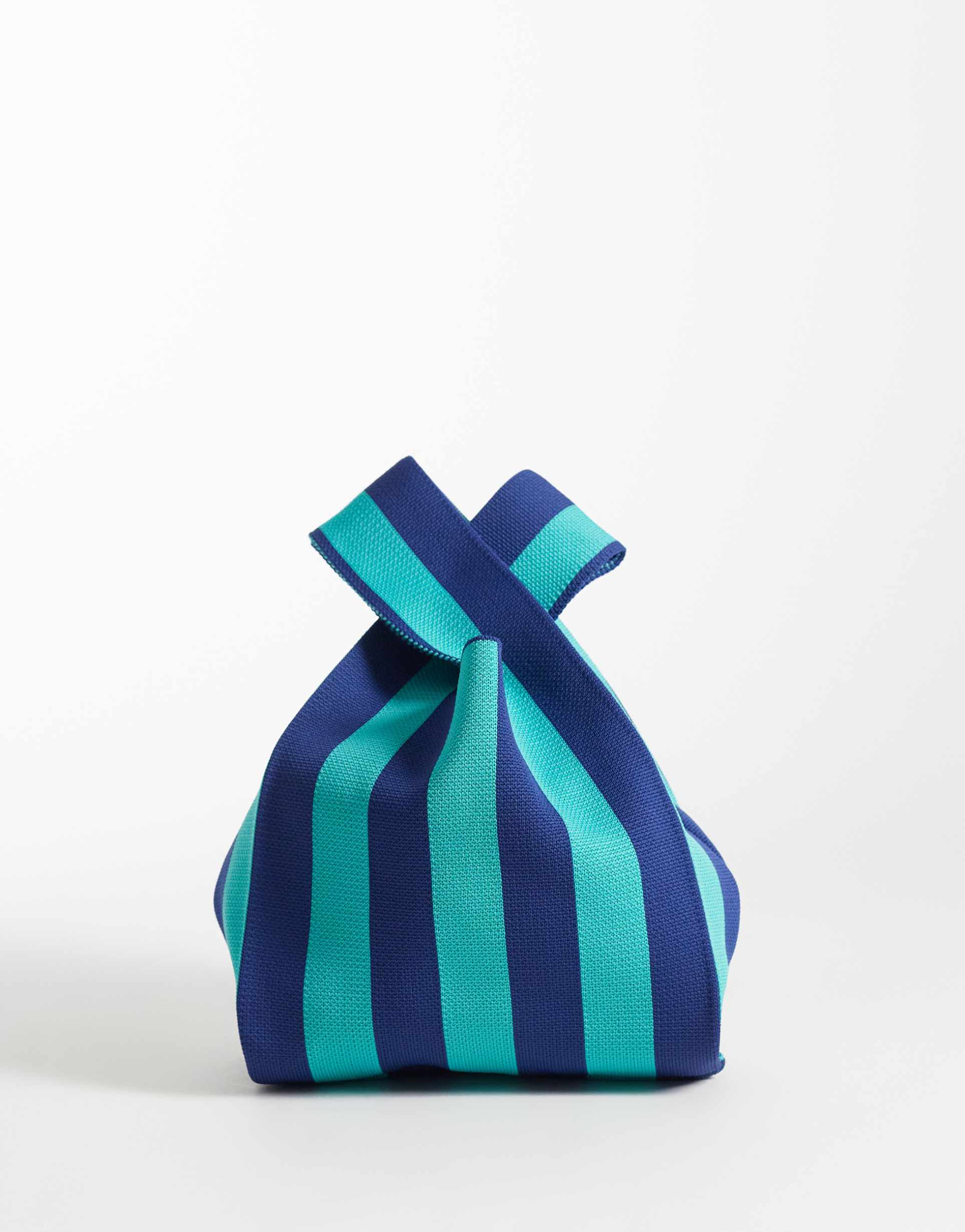 asos design loop through clutch bag in blue stripe