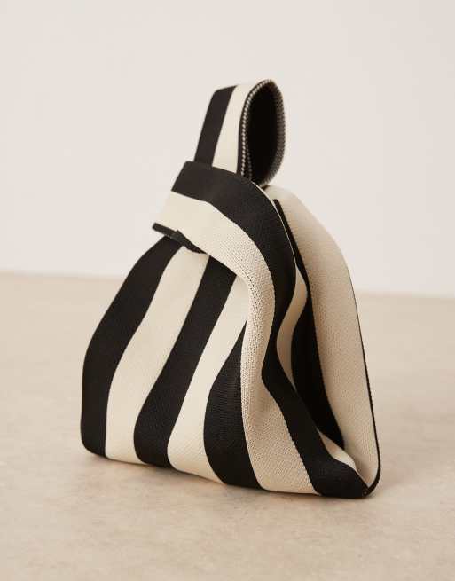 ASOS DESIGN loop through clutch bag in black and cream stripes