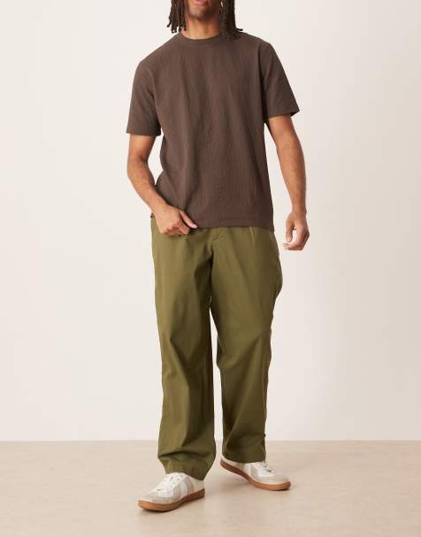 ASOS DESIGN loose chinos in khaki with pleats - view 1