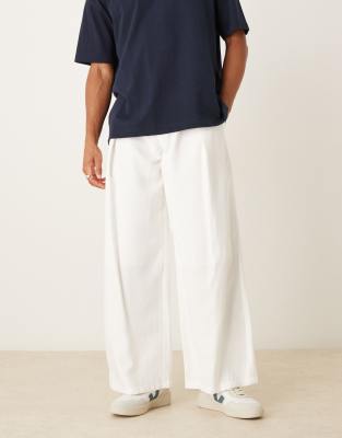 loose fit pants with deep pleat detail in white