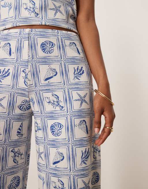 ASOS DESIGN loose fit wide leg pants in shell print - part of a set