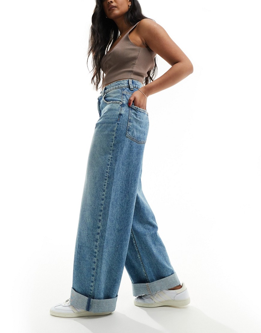 ASOS DESIGN loose jean with deep turn up in tinted mid blue