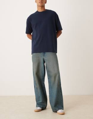 ASOS DESIGN loose jeans in mid wash blue with brown tint