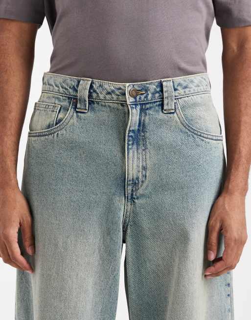 ASOS DESIGN loose jeans with darts in mid-wash blue with tint