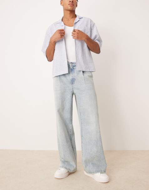 ASOS DESIGN loose jeans with front pleats in light wash blue - view 1