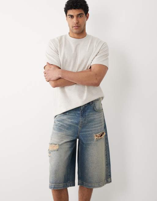 ASOS DESIGN loose jorts in mid washed blue with rip, 2 of 5