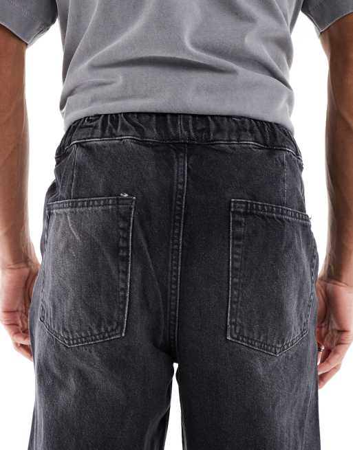 ASOS DESIGN loose straight jeans with trackie styling in black wash