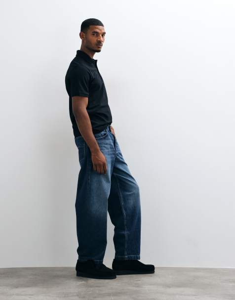 ASOS DESIGN lösa jeans i mörkblå tvätt med veck och spänne - view 1