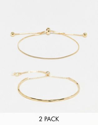 ASOS DESIGN pack of 2 bracelets with simple toggle detail in gold tone - ASOS Price Checker