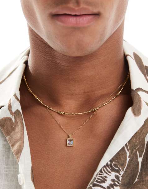 ASOS DESIGN - Lot de 2 colliers de perles de festival en acier inoxydable avec pendentif à strass - Doré - view 1
