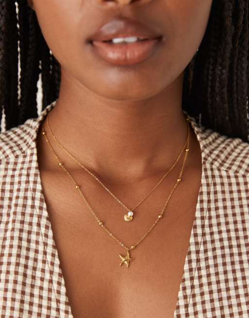 ASOS DESIGN - Lot de 2 colliers en acier inoxydable étanche à pendentifs aquatiques - Doré