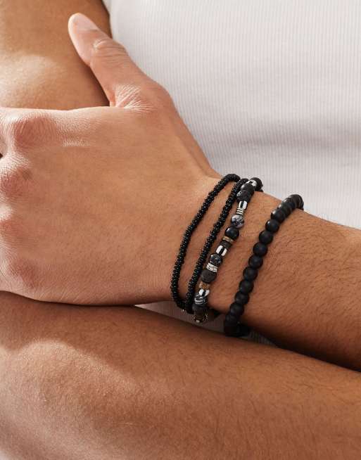 ASOS DESIGN - Lot de 4 bracelets style festival en corde avec perles fantaisie - Noir  