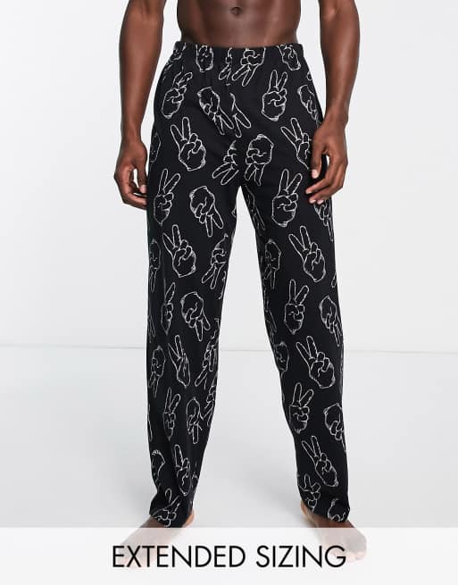 ASOS DESIGN lounge bottom in black with peace hand print