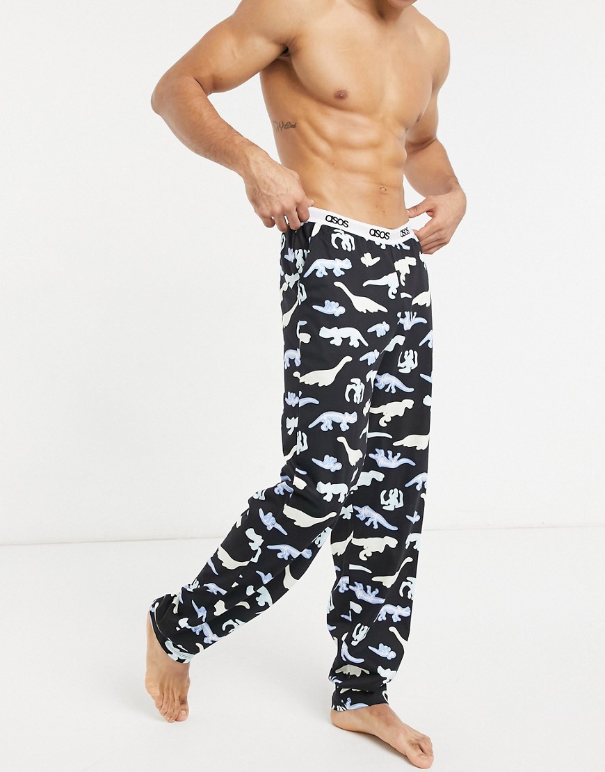 ASOS DESIGN lounge bottoms in black with bright dino print