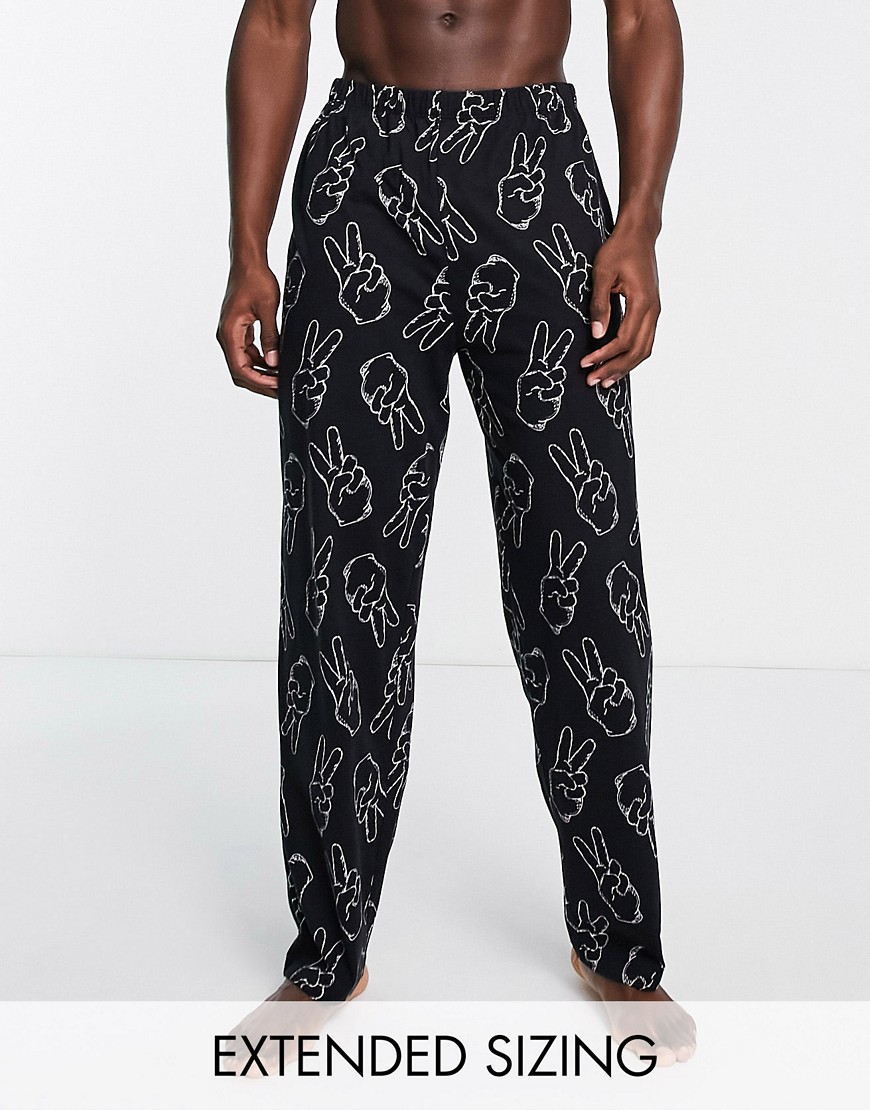 ASOS DESIGN lounge bottoms in black with peace hand print