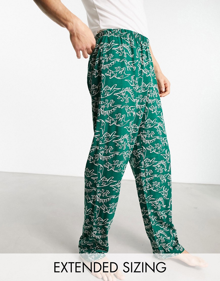 ASOS DESIGN lounge bottoms in green with dinosaur print