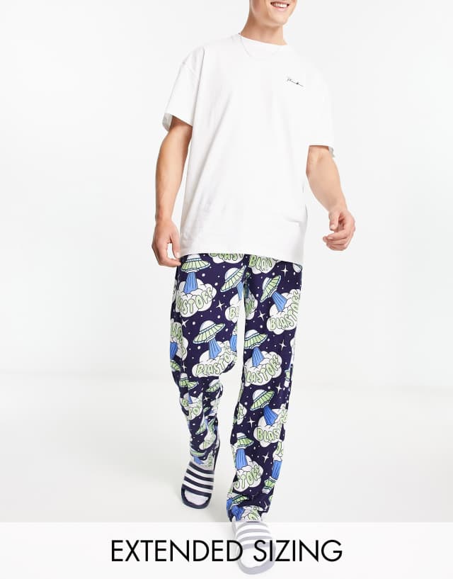 ASOS DESIGN lounge bottoms in navy with blast off print