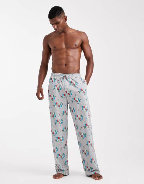 ASOS DESIGN lounge bottoms with Christmas Feliz Navidad graphic in grey - view 1